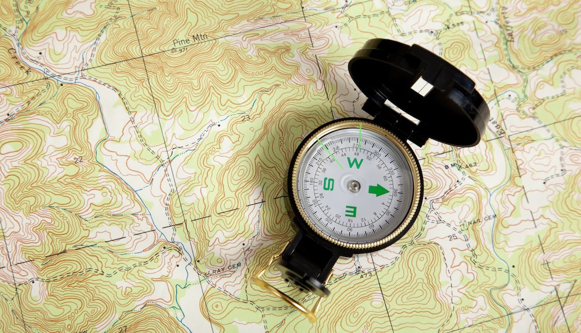 compass on a map signifying guidance
