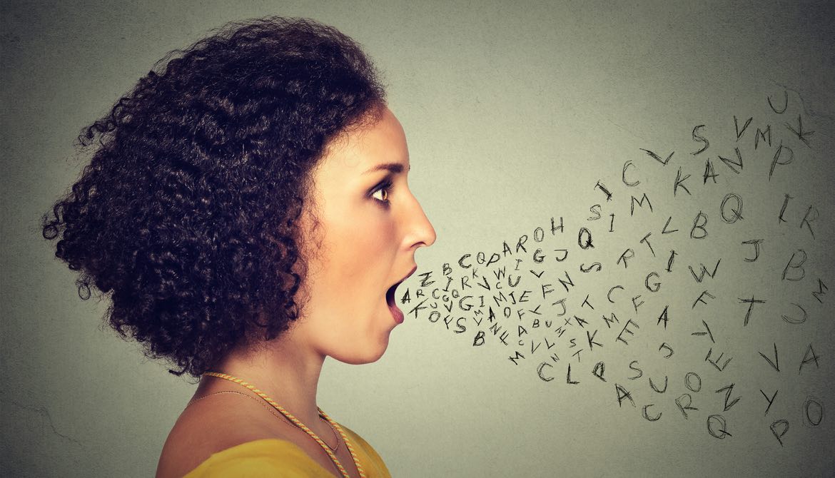 Woman talking with alphabet letters coming out of mouth