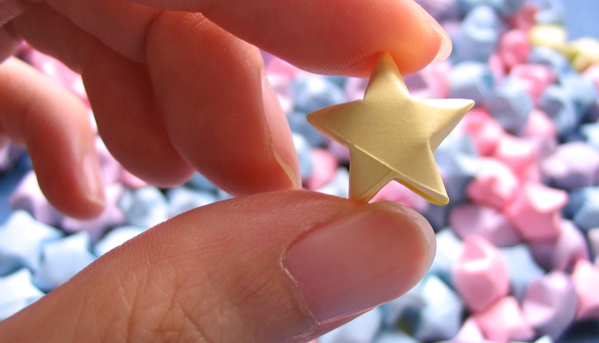 hand holding a small star
