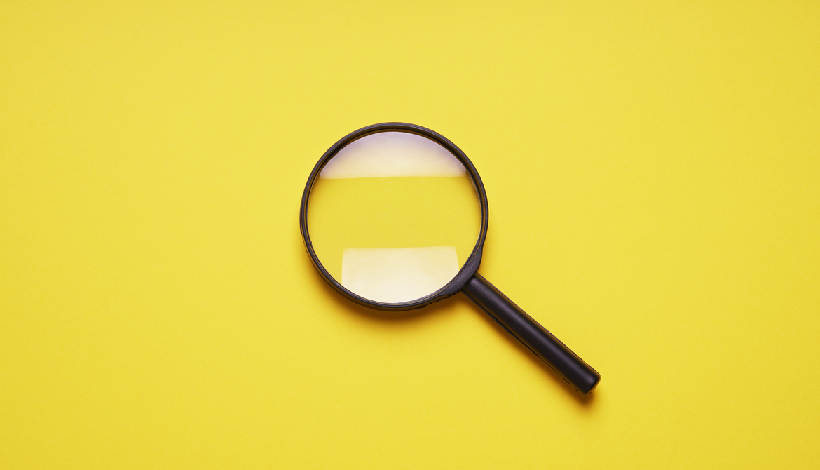 magnifying glass on yellow background 