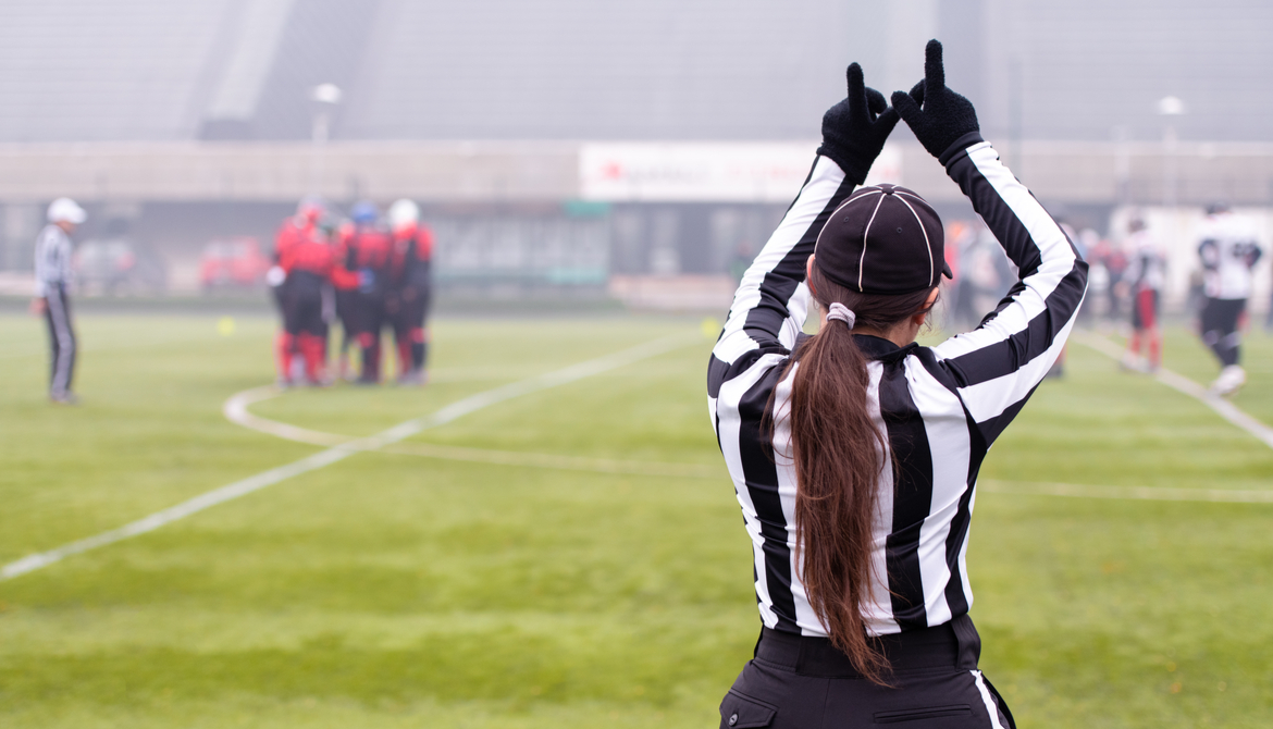female referee on football field