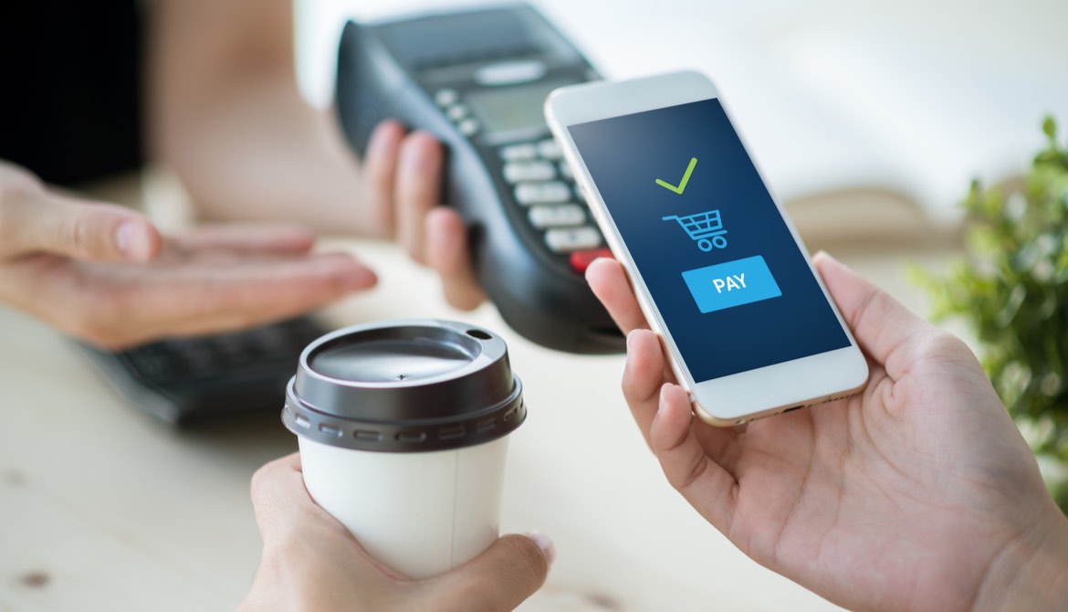 paying for coffee with contactless option using smartphone
