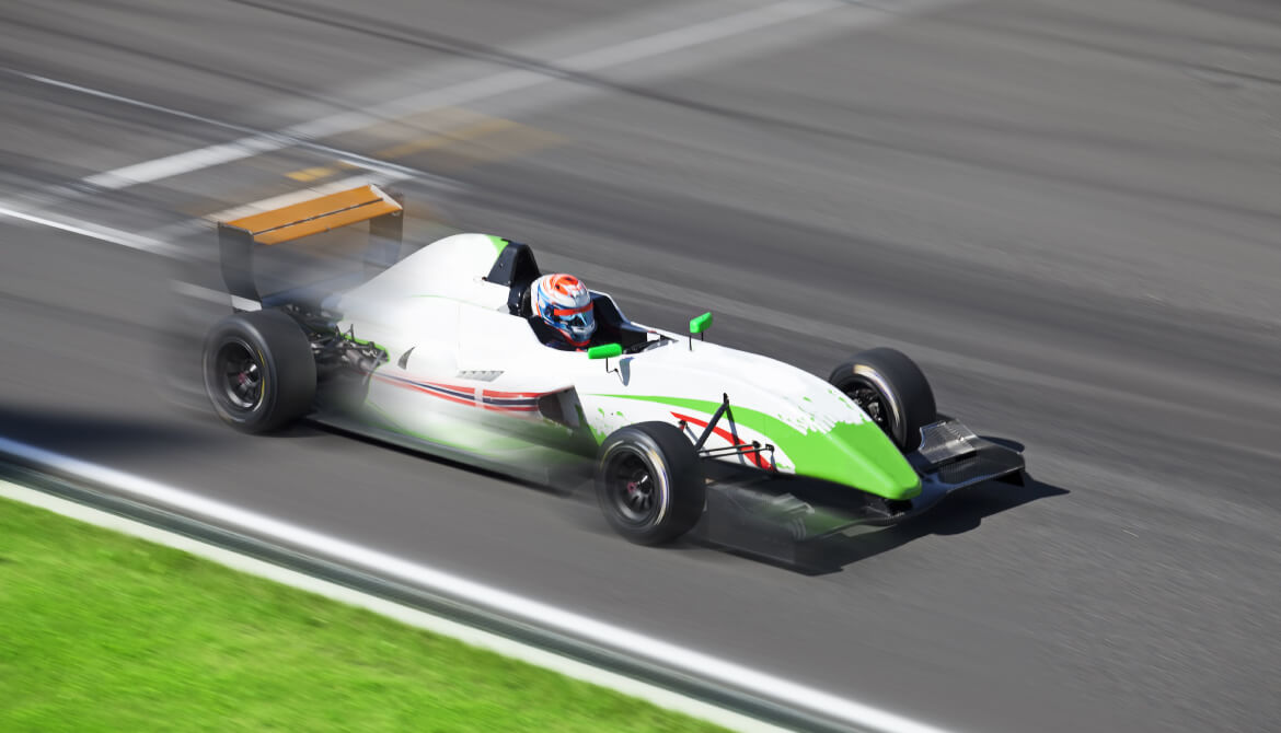 green and white formula race car racing