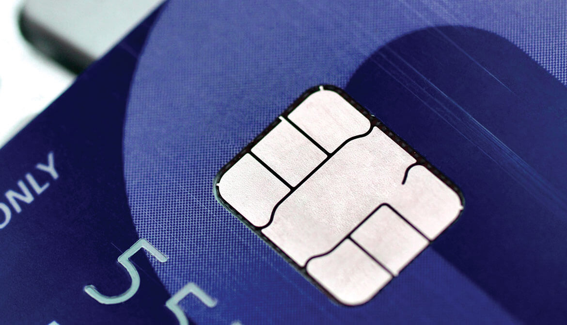 closeup of EMV chip on a blue credit card 