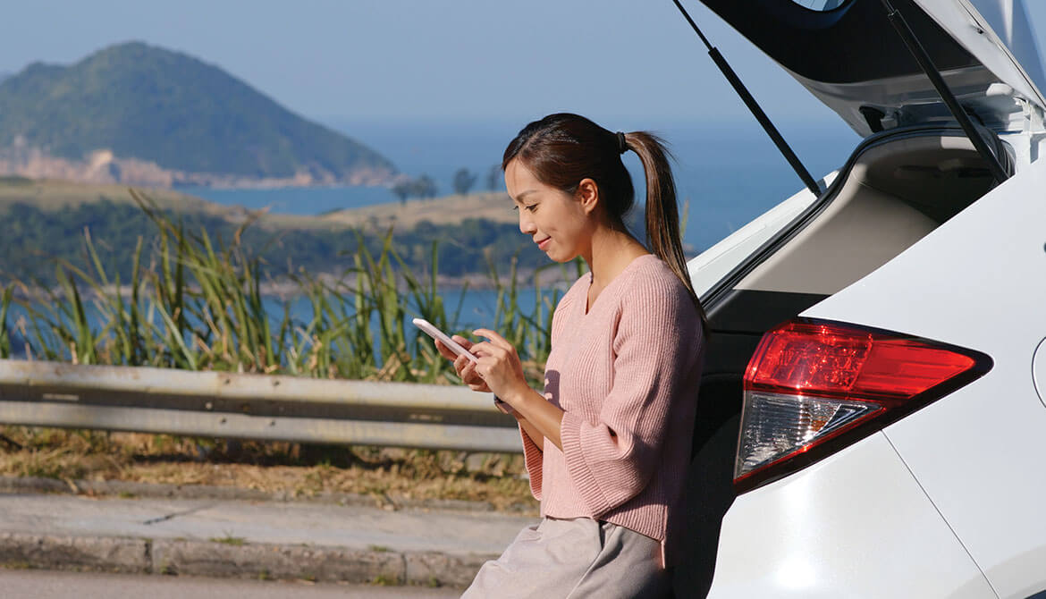 smiling young woman using smartphone while leaning against open hatch of SUV at highway scenic overlook<p>Have branch, will travel” is the new slogan for many credit union members.&nbsp;</p>  <p>A growing number of members prefer to take their favorite branch with them everywhere they go, keeping it handy for when they need to deposit a check, transfer money between accounts or review their balances.</p>  <p>If that sentence left you with the image of a person burdened by a branch on their back, think again