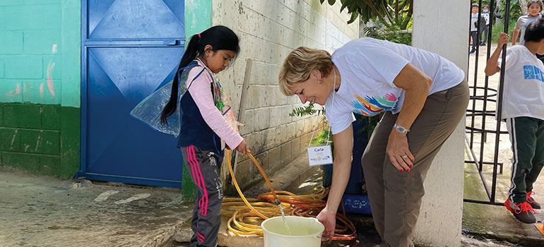 Carla Cicero works on a community project at a school in Guatemala