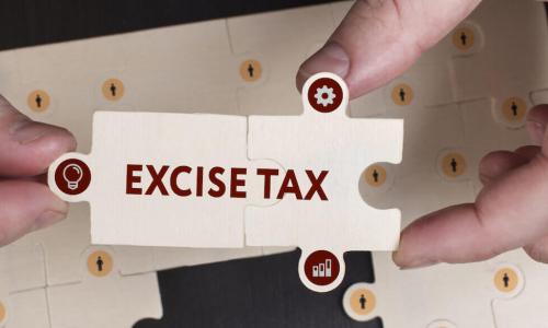 puzzle pieces fit together to spell out excise tax
