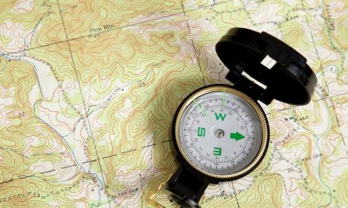 compass on a map signifying guidance