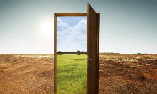 door from a dry climate opening to a greener climate
