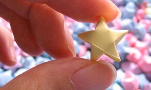 hand holding a small star