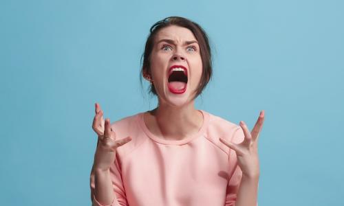 frustrated young woman screaming