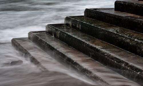 tide rising to cover stone stairs