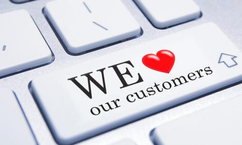keyboard with buttons saying we love our customers