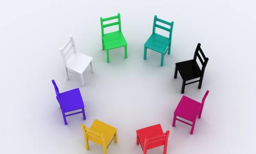 diversity illustrated through a circle of chairs of different colors