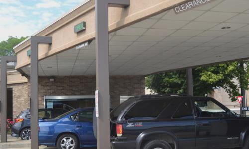 cars in busy credit union drive-thru lanes