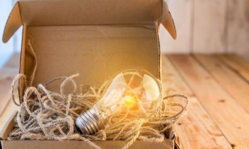 light bulb with string in a cardboard box