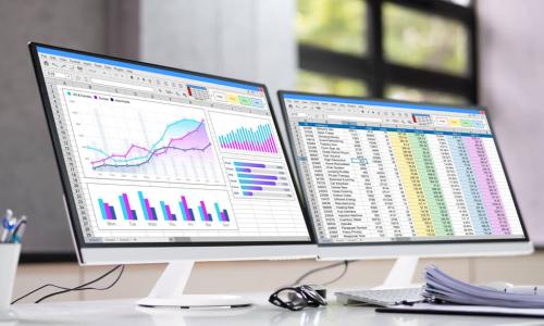 data analyst spreadsheet on two monitors