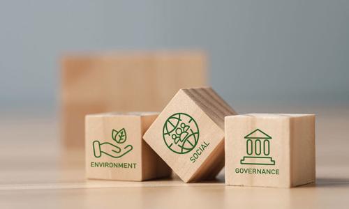 wooden blocks with environmental social governance pictures on them