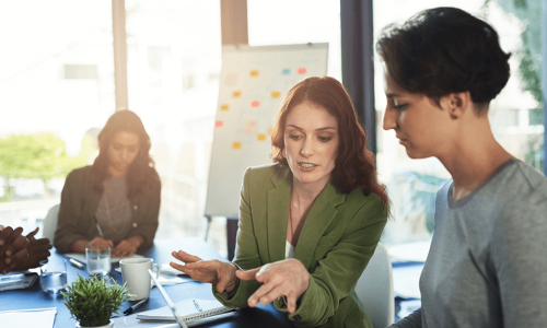 co-workers sitting at a table talking