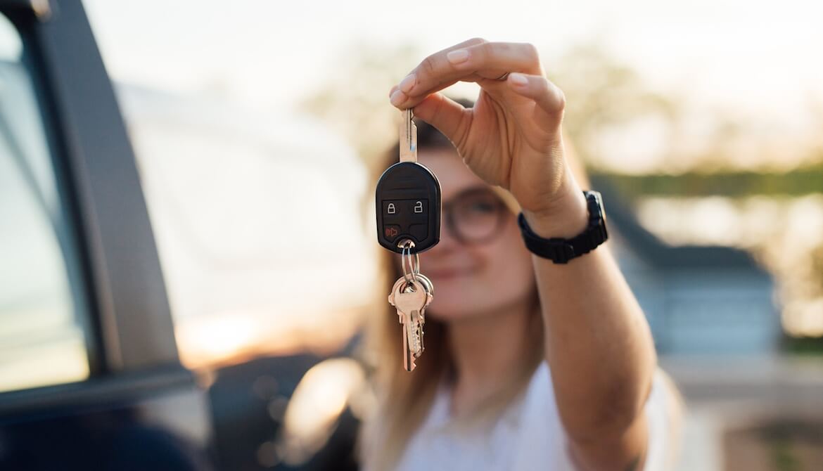Millennial proudly showing off keys to new truck