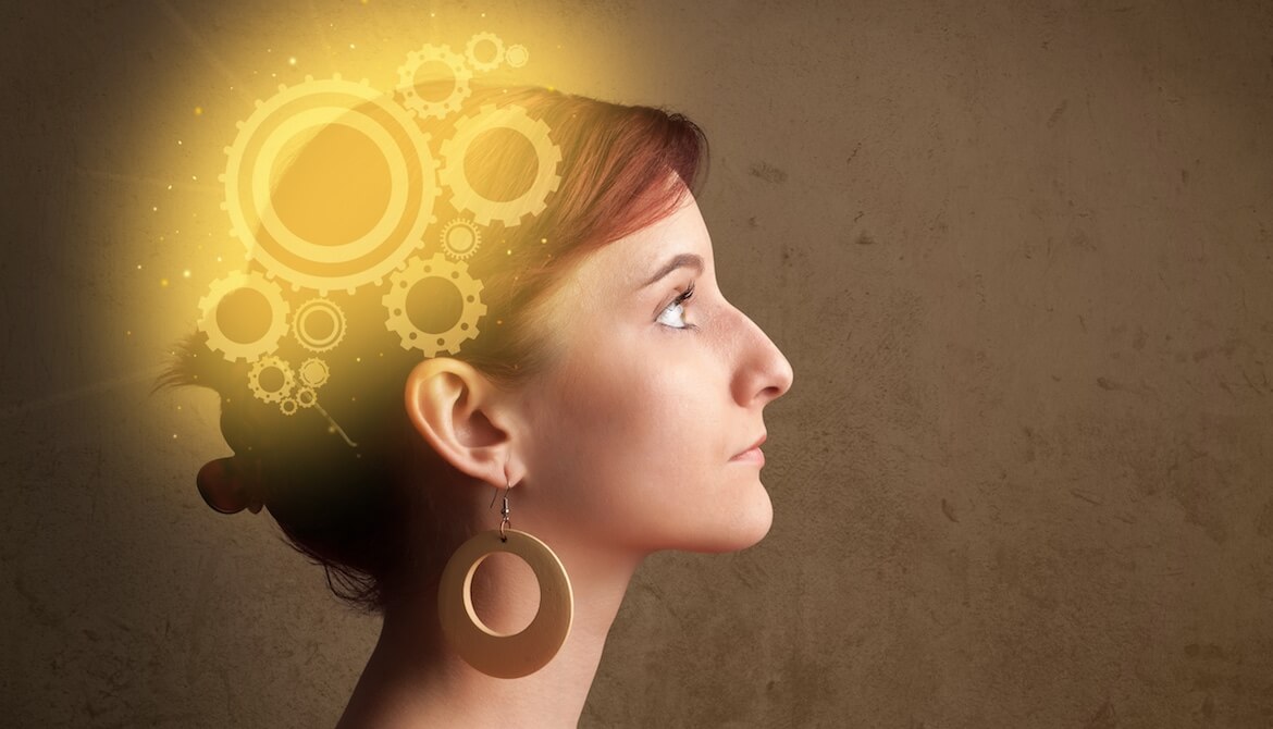 woman with glowing cogs in her brain illustrates neuroscience and employee motivation