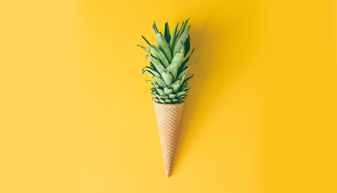 pineapple growing out of an ice cream cone