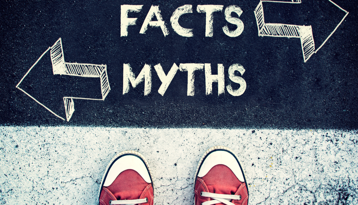 shoes on the pavement that has written on it "facts" and "myths"