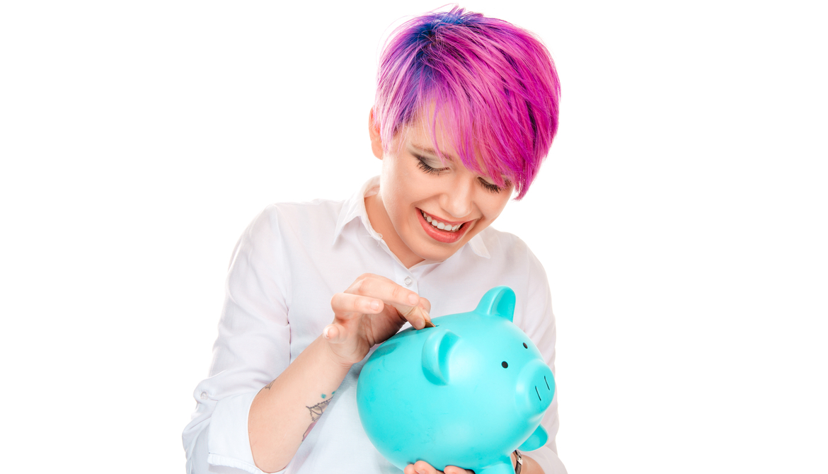 millennial with pink hair putting money in a pig savings bank