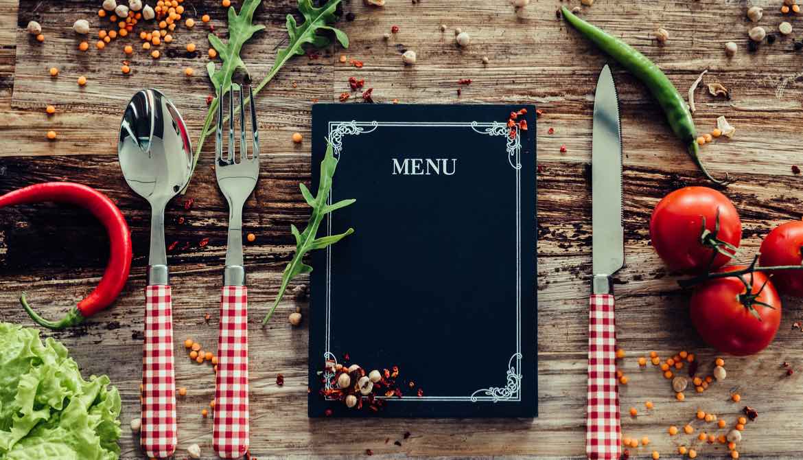 menu as part of a placesetting on a table