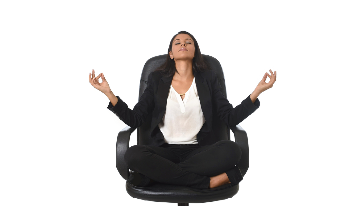 business woman meditating in an executive chair