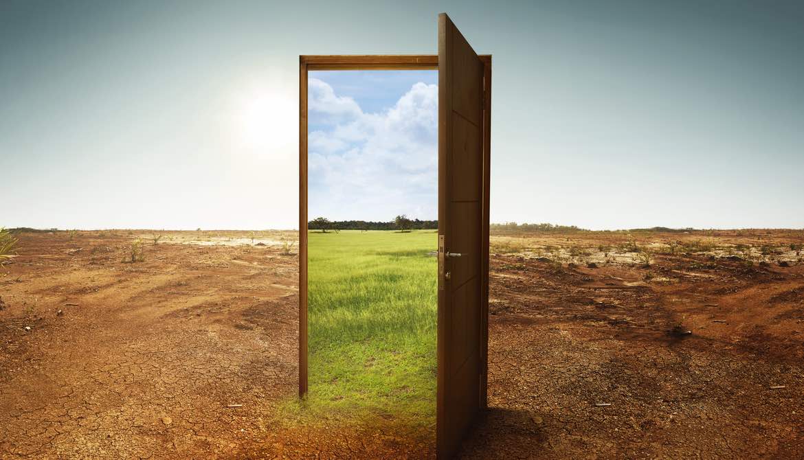 door from a dry climate opening to a greener climate