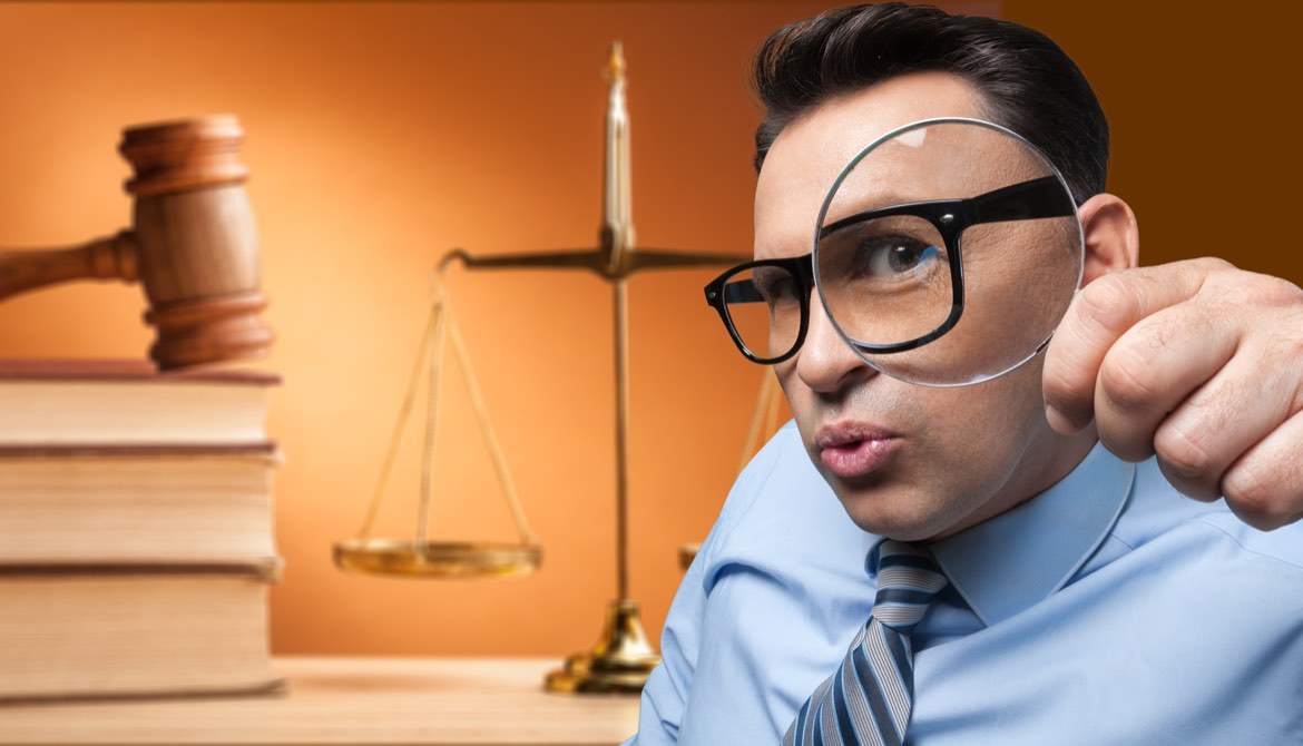 businessman glasses looking out through magnifying glass