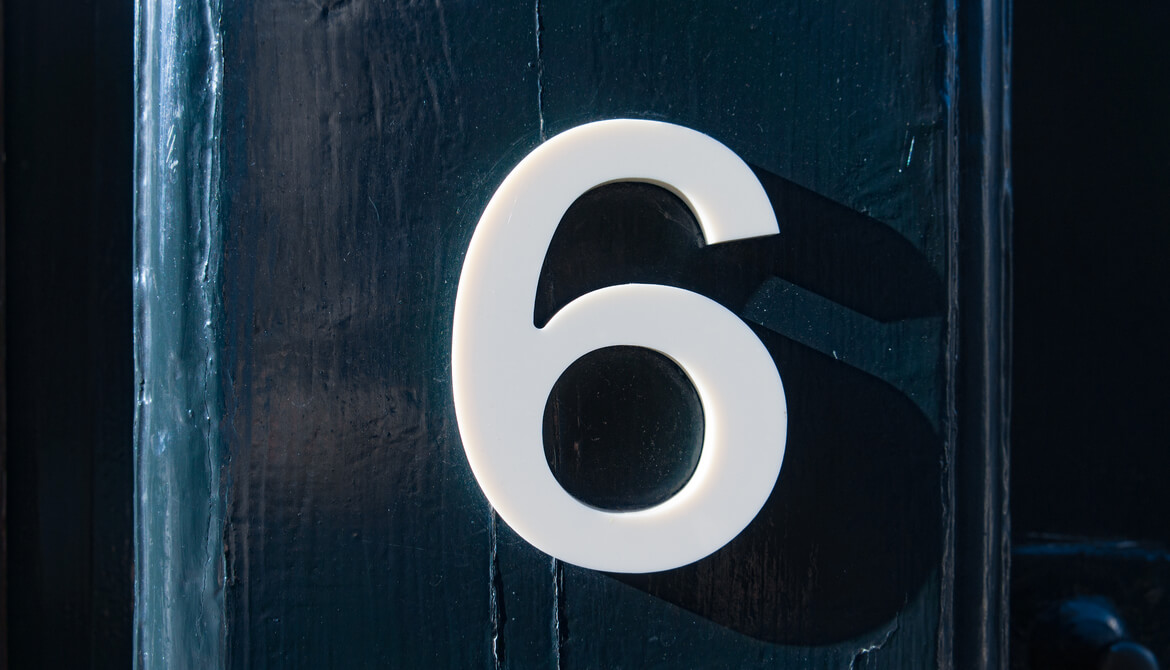 number six on a blue wooden door