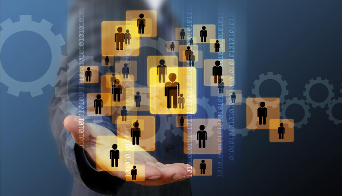 Business leader with array of people icons floating above his hand while he searches for the right person