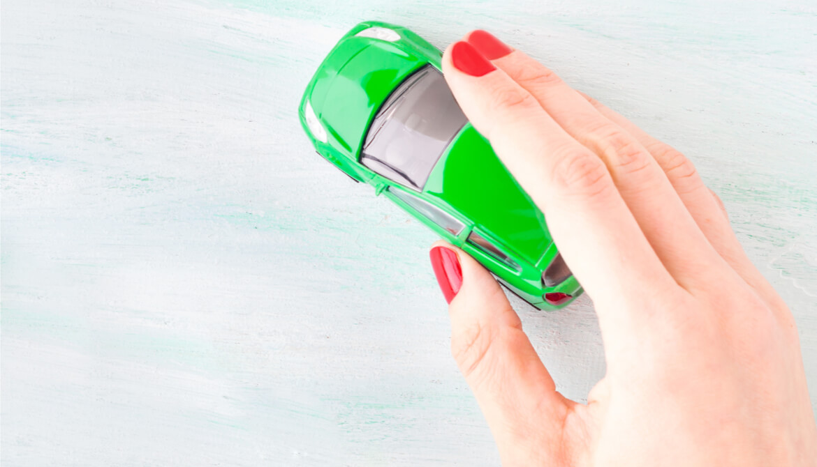 Toy car in woman's hand