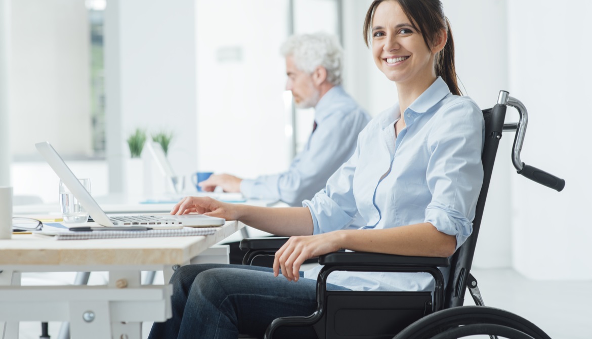 confident female employee using a wheelchair