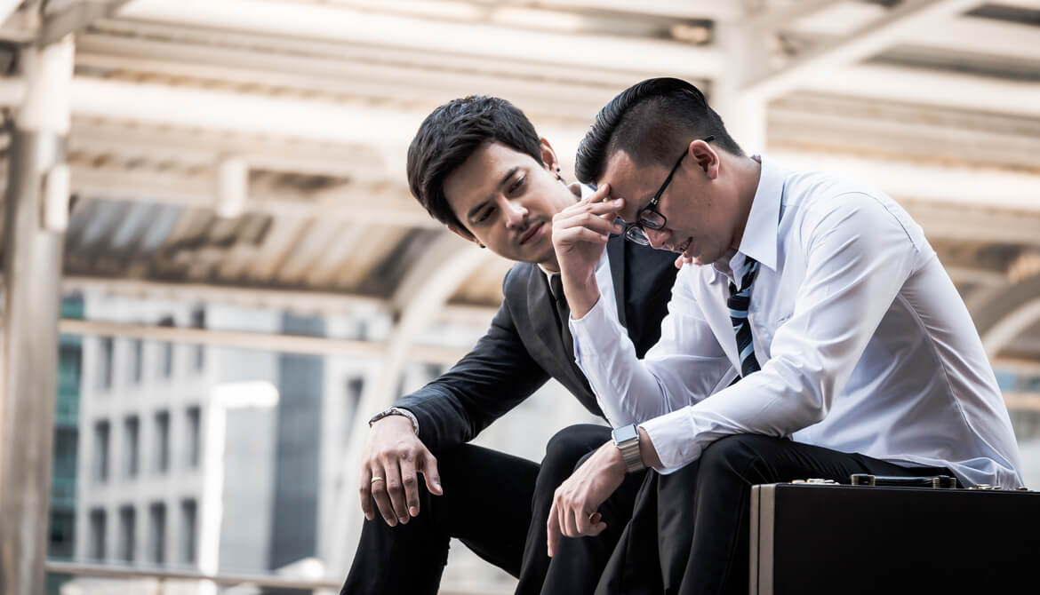 business manager reassures frustrated and upset employee