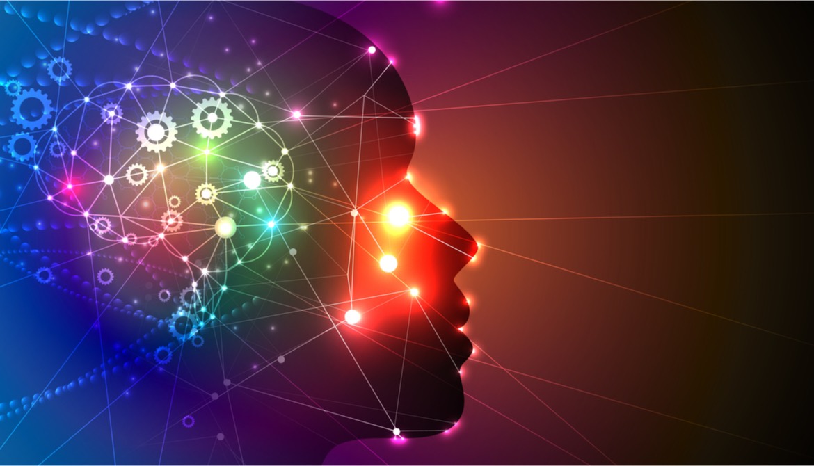 silhouette of human head with digital illustration of a glowing network connected to brain