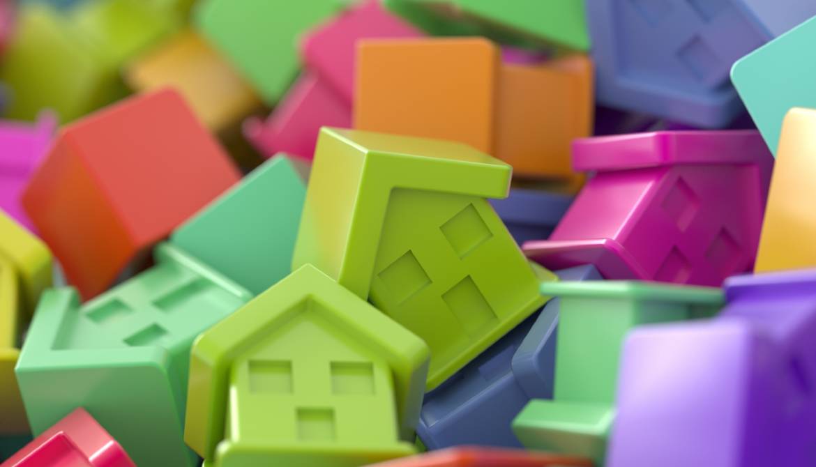 colorful plastic houses mortgage market concept