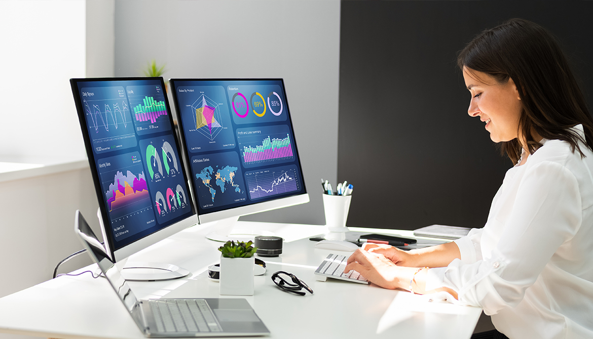 woman looking at Analytics on her computer monitor