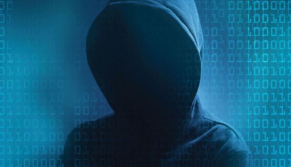 shadowy hacker figure in a dark hoodie