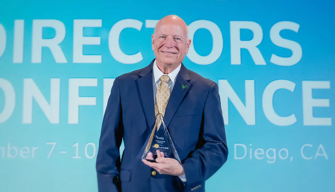 Dr. Rick Will with his 2025 CUES Distinguished Directors Award at CUES Director Conference