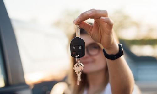 Millennial proudly showing off keys to new truck
