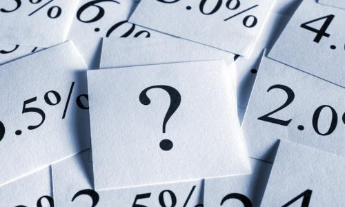 many cards displaying interest rates around a central question mark