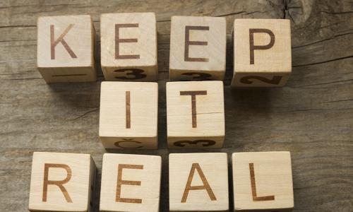 KEEP IT REAL spelled out on wooden blocks