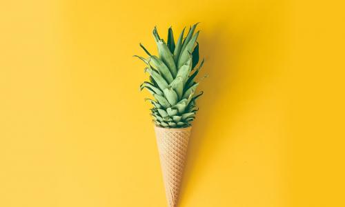 pineapple growing out of an ice cream cone
