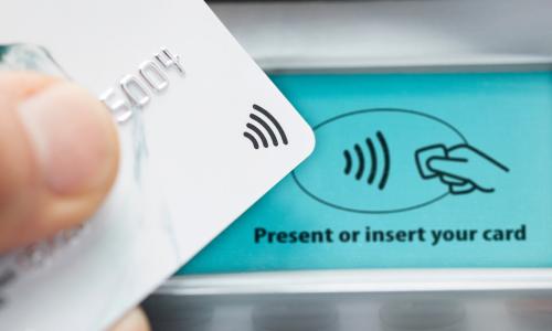 Close up of a credit card being used to make a payment on a contactless card machine