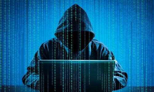 hacker using laptop computer