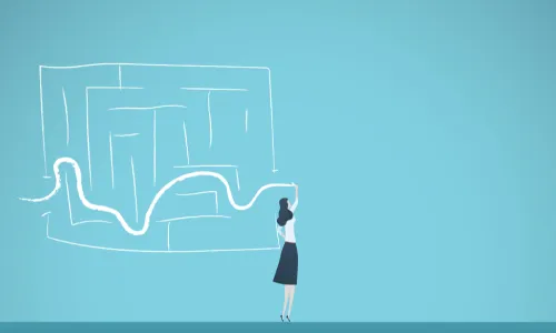 female leader finding her way through a chalk maze