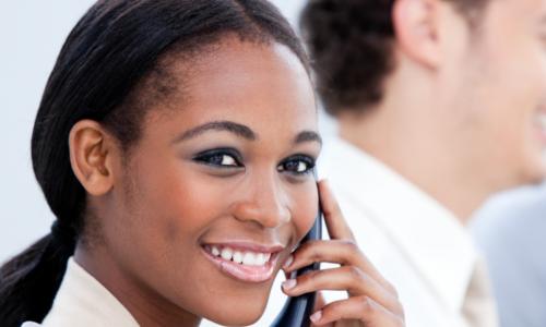 african-american business woman smiling while on the phone
